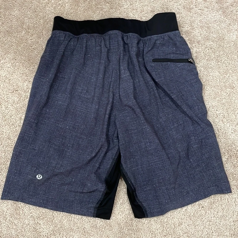 Lululemon Dark gray and black mens shorts.